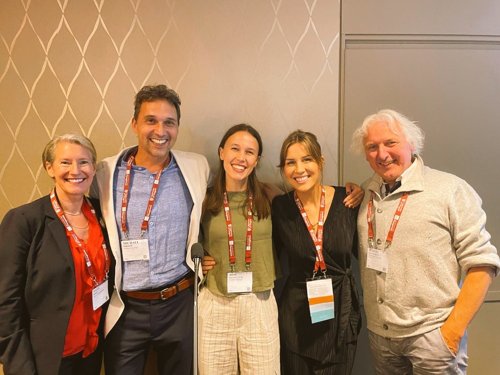 yemiscigil's tweet photo. Reflecting on #AOM2023 as I ride the return train...I truly love conferences. They give so much meaning and joy to my work. 

'The pursuit of truth in the company of friends' is really at the heart of why I love my job.🤍

This year, sharing meals and hugs with Zoom colleagues was a true blessing. And we gave some fun and generative presentations together. 

I made sure that whatever I presented at AOM wasn't dry, it had energy and clear takeaways. And I only attended sessions that promised joy and vigor (beyond intellectual contribution). This is a new preference that crystallized for me this year. Some sort of job crafting towards what is replenishing vs. depleting. I wish more presentations paid attention to this.

I was also surprised by the new friendships I made in the most unlikely places, sessions I didn't plan to attend, sitting idly at coffeeshops, in restrooms. These serendipities remind me I don't need to plan so tightly to make the best of an experience. I even doubt if my plans are fully in my best interest. When making plans, I choose people who are similar to me or fit some sort of aspiration, when I relax the plans, I meet people who are different and enriching in unexpected ways.

I also really love being alone at a conference. My sensemaking works in full capacity as I move between sessions, lightly listen and engage, and be in my own thoughts and body when it is social around. Ideas about research projects and identity fall into places in these what may be called liminal spaces. And somehow I hear myself more clearly when other people are talking without necessarily expecting an answer from me. 

Well, it feels like this year's conference was more about 'being' a researcher rather than learning about research.✨️