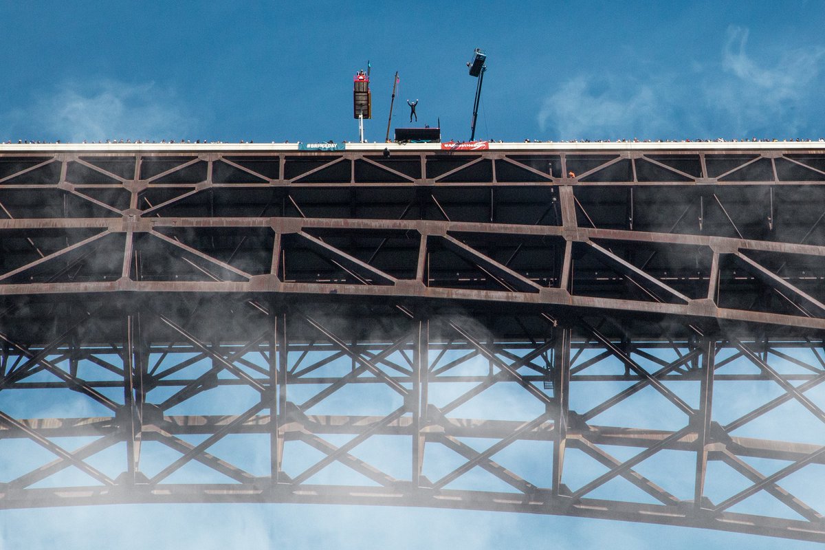 The Bridge Day highlight of the day for many is watching the skilled BASE jumpers, and for those bold and daring enough, there are even a limited amount of tandem tickets available! Book your tandem jump: bit.ly/3NPwNWm