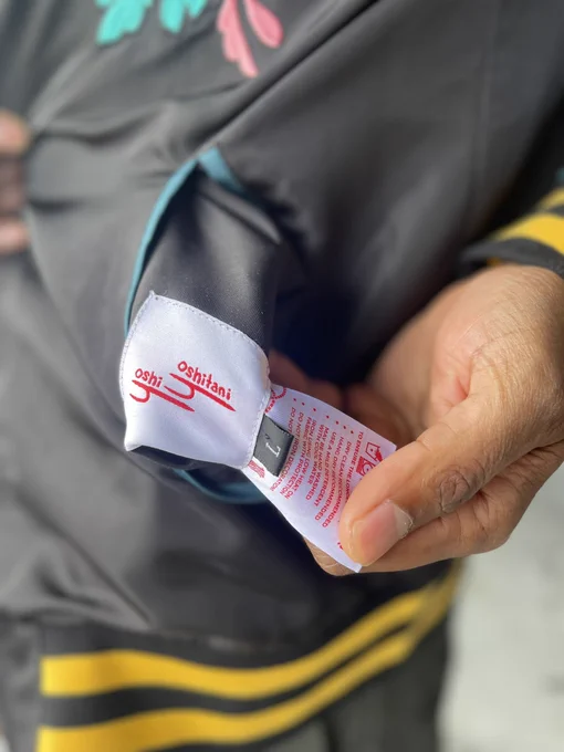 Care instructions are sewn into one of the 4 pockets (2 on each reversible side) 