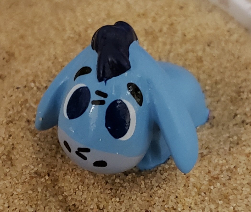 brianne1017's tweet photo. This is my new Eeyore Sand Garden. I'm putting it on my desk at work. Let's see how long it takes before it gets stolen, broken, or destroyed. #ThanksForNoticingMe https://t.co/nqnoStinMX