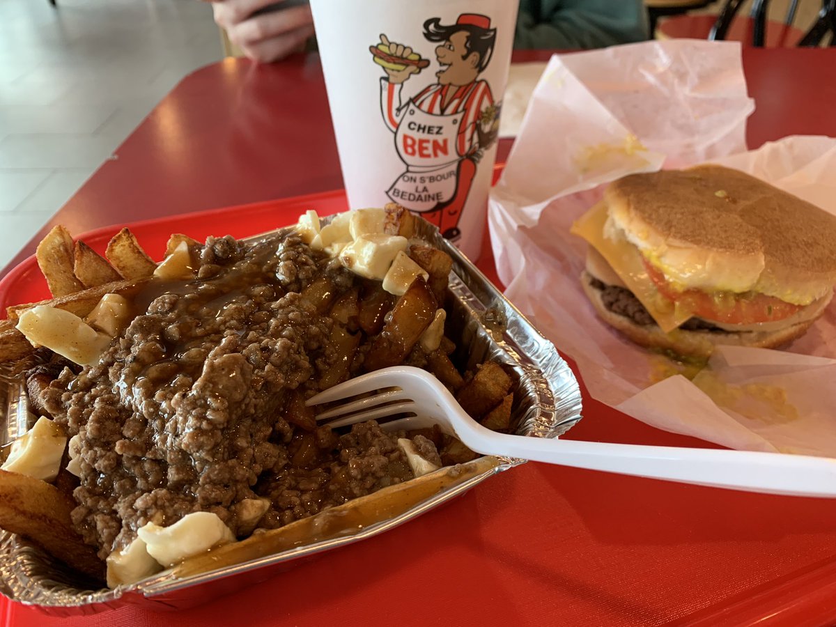 Hackknife's tweet photo. Convinced the kid to stop for “first dinner” at Cantine Ben la Bedaine, a traditional Quebecois casse-croute (snack bar) in Granby. Behold the Bourre-Bedaine trio: poutine (topped with bouche-trou, the house’s seasoned loose ground meat), fully dressed double burger, and soda… https://t.co/868GpPa9jC