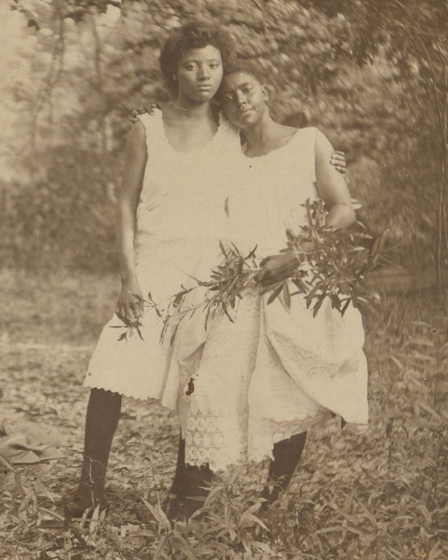 This candid photo was taken around 1905 and captures a casual embrace between two unidentified black women in what seems to be a forest or orchard. It is archived in the Loewentheil Collection of African-American Photographs. Handwriting on the back indicates their names as…