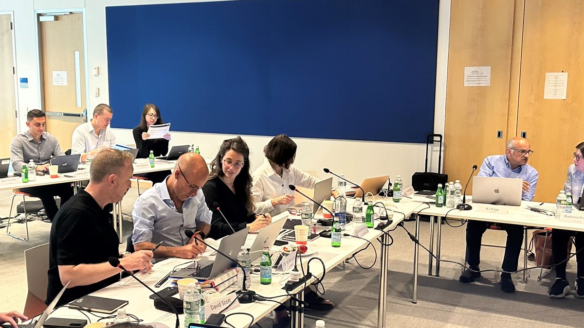 Members of Cancer Grand Challenges Scientific Committee discussing applications. 