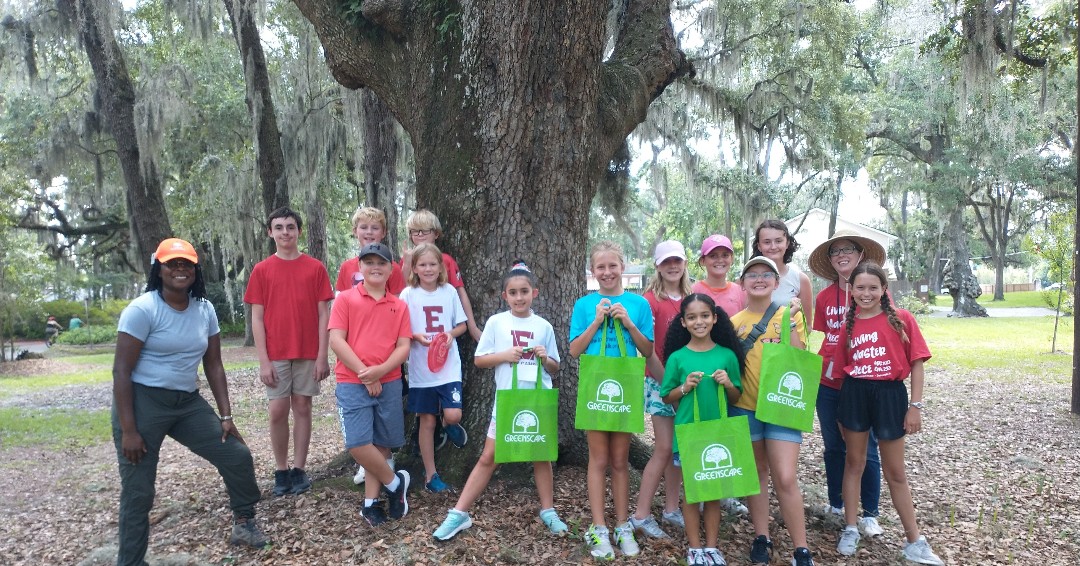 greenscapeofjax's tweet photo. We beat the heat to water, weed & mulch 27 trees in Columbus Park with @StMarksEYCJax Led by our new Program Manager, Shanell Davis-Bryant, this youth team learned about the benefits of trees (including shade!) and proper tree care. @CityofJax #urbanforest #teamwork #wedigtrees https://t.co/GHhNNhqYgu