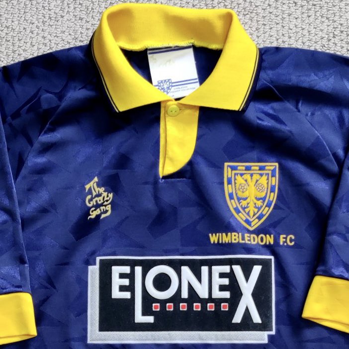 Although similar to the Core & Lotto branded shirts that would follow, this shirt is special. The full yellow collar & sleeve cuffs, but most importantly “The Crazy Gang” where the manufacturer logo would be. In my honest opinion, the best in-house shirt made in the modern era.