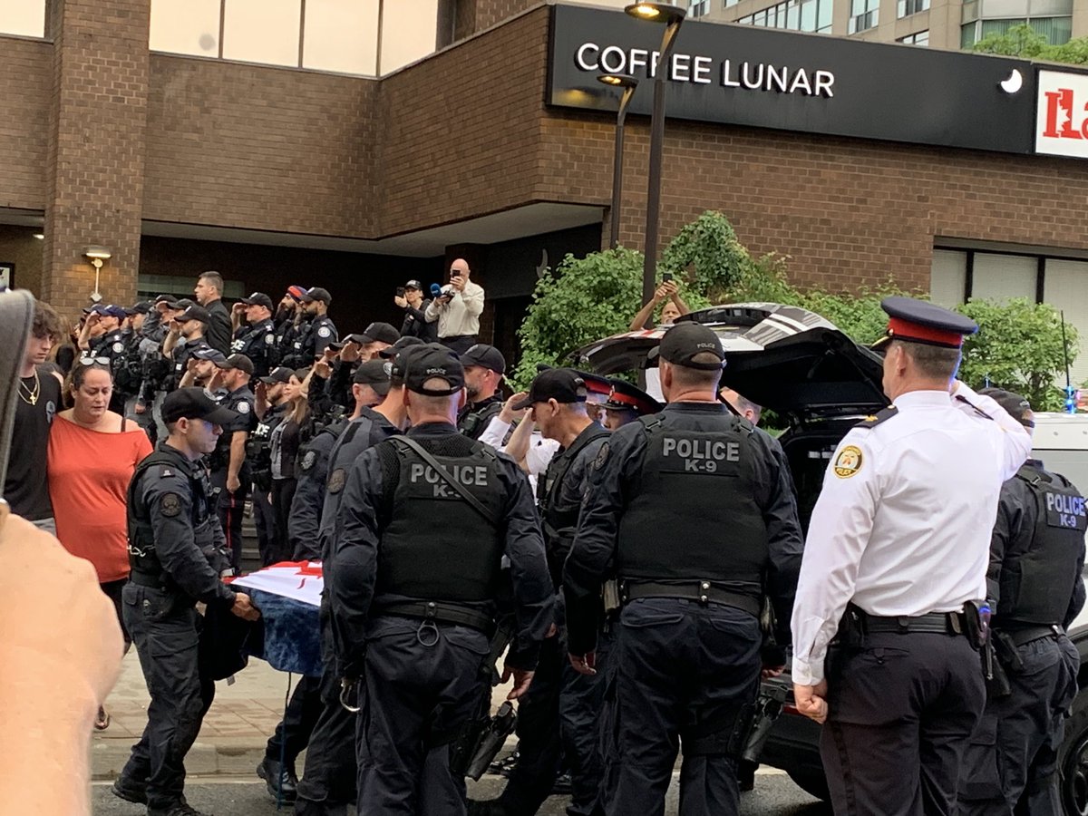 Emotional moment as Sgt. Smith and his family escort Bingo from the vet clinic and into a Toronto Police K9 vehicle. Procession will continue to Guelph University for a celebration of life