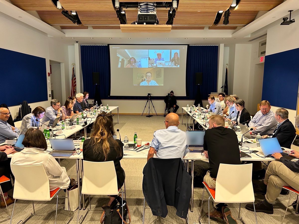 Members of Cancer Grand Challenges Scientific Committee discussing applications. 
