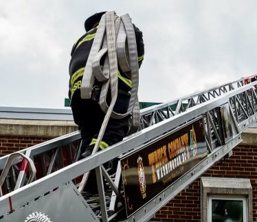 dcfireems's tweet photo. During the course of their probationary period, rookie firefighters are continually tested on their skill sets. Here a probationer from Engine 3 advances a hose line up an aerial ladder. Every day is a training day. #DCsBravest https://t.co/wRK4sP2tXw