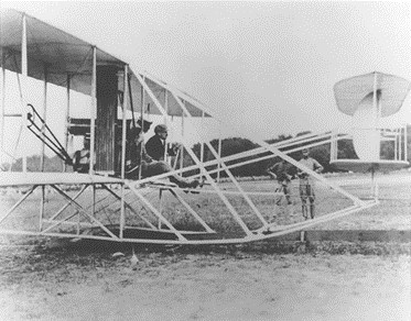AFHF's tweet photo. 1909: Orville Wright, with Lt Frank P. Lahm riding as a passenger, flew the Army’s first airplane for 1 hour 12 minutes 40 seconds to set a two-man endurance record. Thus, the first official flight test of the airplane fulfilled a contract requirement for an hour-long flight with a passenger. (Lahm is seated in the right seat of the plane. Orville is hunched over in the left seat.)