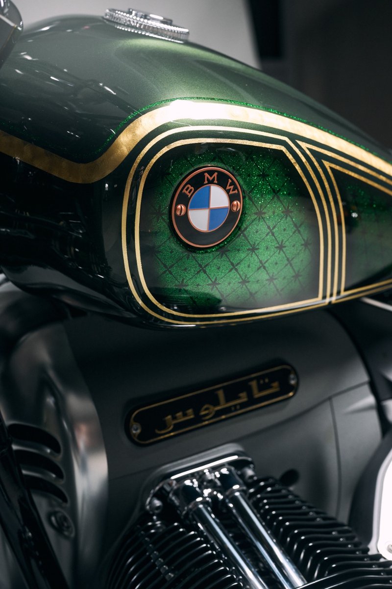 BMWMotorrad's tweet photo. The custom-built #BMWR18 "Tylos" reflects the greenery of ancient Bahrain. 💚 

The unique painting of green and yellow is partly made of 21-carat gold leaves.

#MakeLifeARide #BMWR18Custom #CustomBike #NotForSale #BMWMotorrad https://t.co/eeeac0zALy