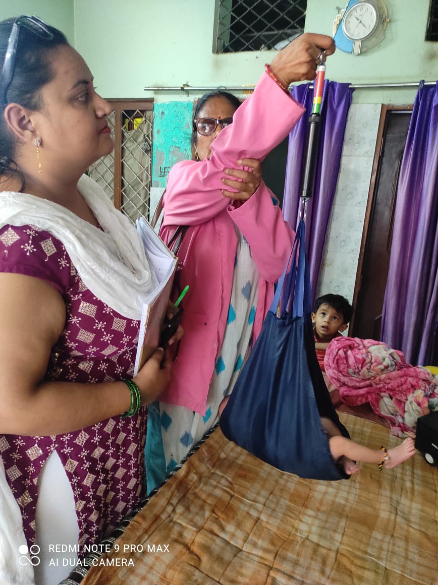 An ASHA worker taking weight of a child during Home Based New Born Care Visit at Brahampuri, UPHC Majra, Dehradun (Uttarakhand)

<a href="/MoHFW_INDIA/">Ministry of Health</a> <a href="/drdhansinghuk/">Dr.Dhan Singh Rawat</a> <a href="/OfficeofDhami/">Office Of Pushkar Singh Dhami</a> <a href="/OfficeOf_MM/">Office of Dr Mansukh Mandaviya</a> <a href="/nhm_uttarakhand/">National Health Mission, Uttarakhand</a> <a href="/dmdehradun/">District Magistrate, Dehradun</a>