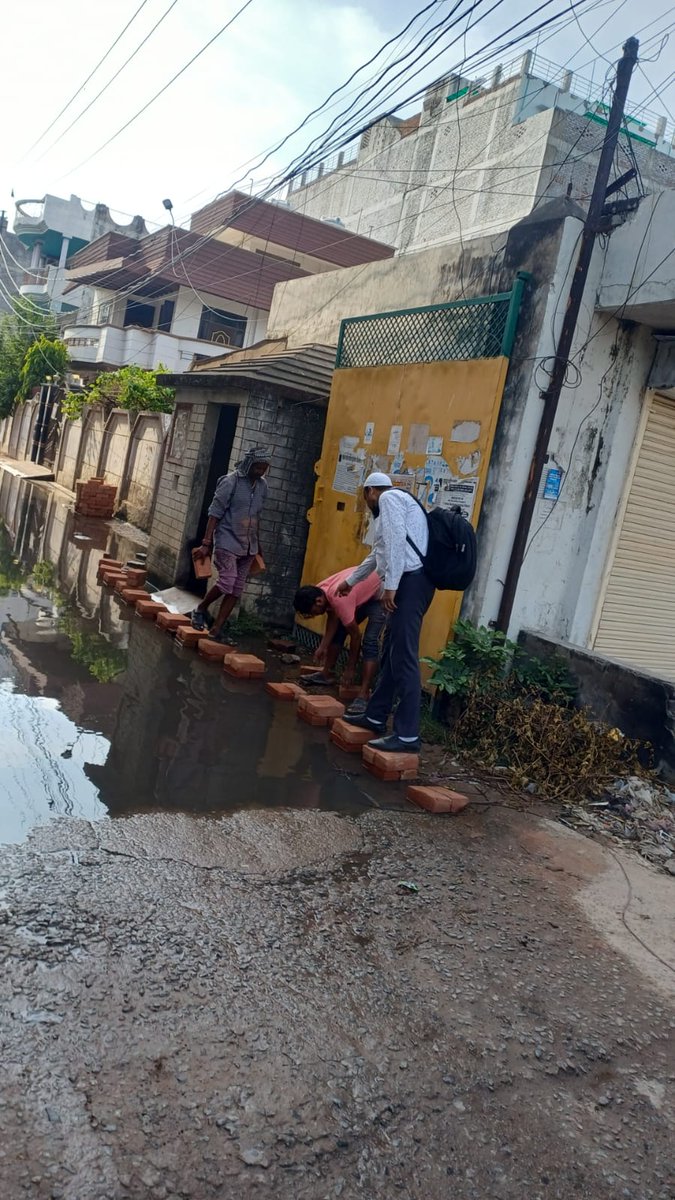 AftabSystem39's tweet photo. Two month passed of the sewage water clogging problem in pokharpur jajmau. But still no proper action taken by anyone. The local itself putting bricks for making the pavement for childrens and women. Please help us specially nagar nigam. https://t.co/1c67oWcWsl