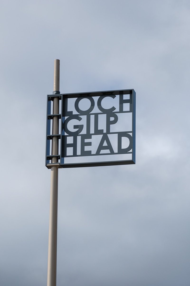 At Lochgilphead Front Green, large landmark signage, in English and in Gaelic announce Lochgilphead to the A83 to encourage visitors to stop, rest, & take in the views, thus increasing footfall in the town and supporting local businesses. Signs made by @Sculptdesign