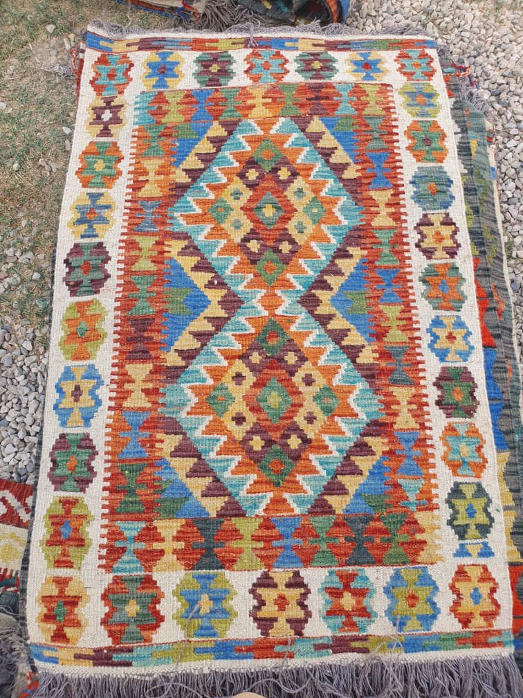 Some of the recently handmade Uzbek kilim rugs from Maymana, Faryab Province, Afghan-Turkestan. With the Taliban occupation of northern Afghanistan, the Turkic carpet industry has been decimated.