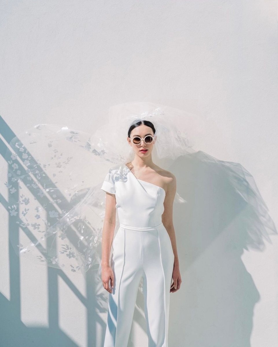 Location: Hotel Bennett

Who ever said you need to wear a dress to walk down the aisle?  Whether saying your I Do's in the white washed Greek Isles or a retro urban destination like Palm Springs, we're swooning over this architectural, one shouldered pant suit.  

Venue <a href="/hotelben/">Ben Barbour</a>