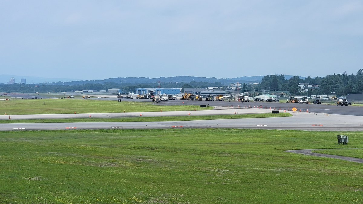 flymanchester's tweet photo. Making progress! 🚧✈️ Our construction and airfield crews are almost done laying the top course of pavement on Runway 17-35. They have 1,500 feet of runway to go! After they finish paving, they will continue installing lights and work on painting the runway markings. #WorkMHT https://t.co/kRiOQBcwRO