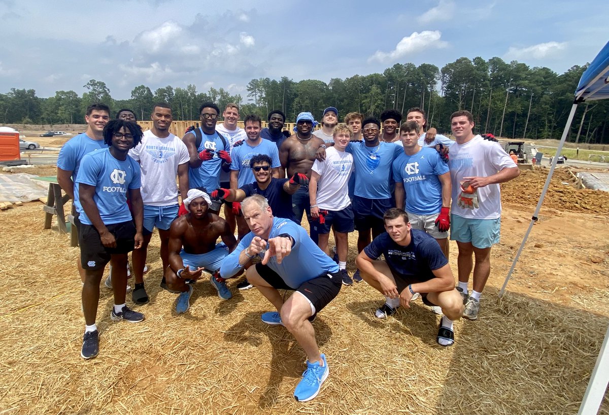 orangehabitat's tweet photo. @UNCFootball 🤝 @weaversgrove 
Thanks for taking the work out to our construction site last week and raising walls with us! https://t.co/Hb0Q7O4UE5