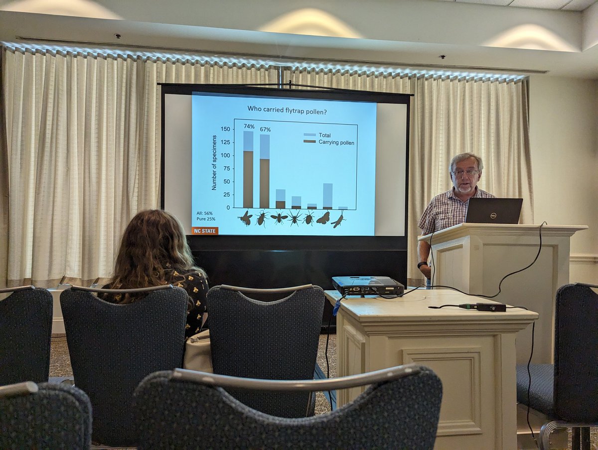 kressuk's tweet photo. The 🐐, Clyde Sorenson, giving @sfiwc22 a rundown on Venus flytrap pollinator/prey dynamics. (And also why it should actually be called the Carolina Ant Trap) https://t.co/nHxrlbcT7B