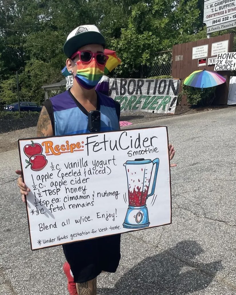 Far left abortion activist who escorts women to clinics to get abortions holds a sign with a recipe including dead fetuses. This is in Greenville, SC. Absolutely sickening.