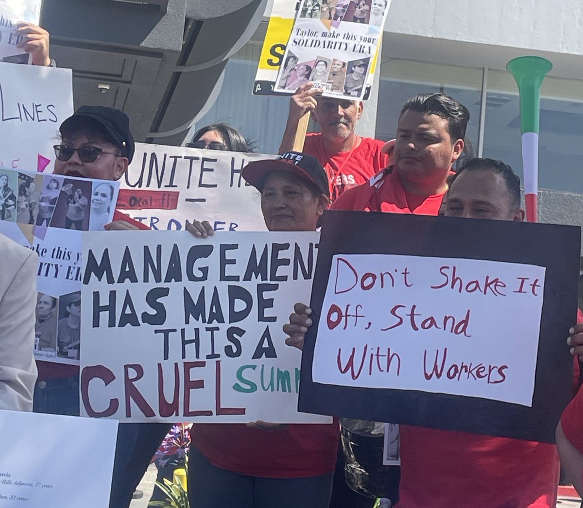 suhaunah's tweet photo. striking hotel workers are urging @taylorswift13 to postpone her LA concerts next week. here are some signs from their protest outside the Hyatt Regency LAX this morning: https://t.co/DRKI8zAbUQ