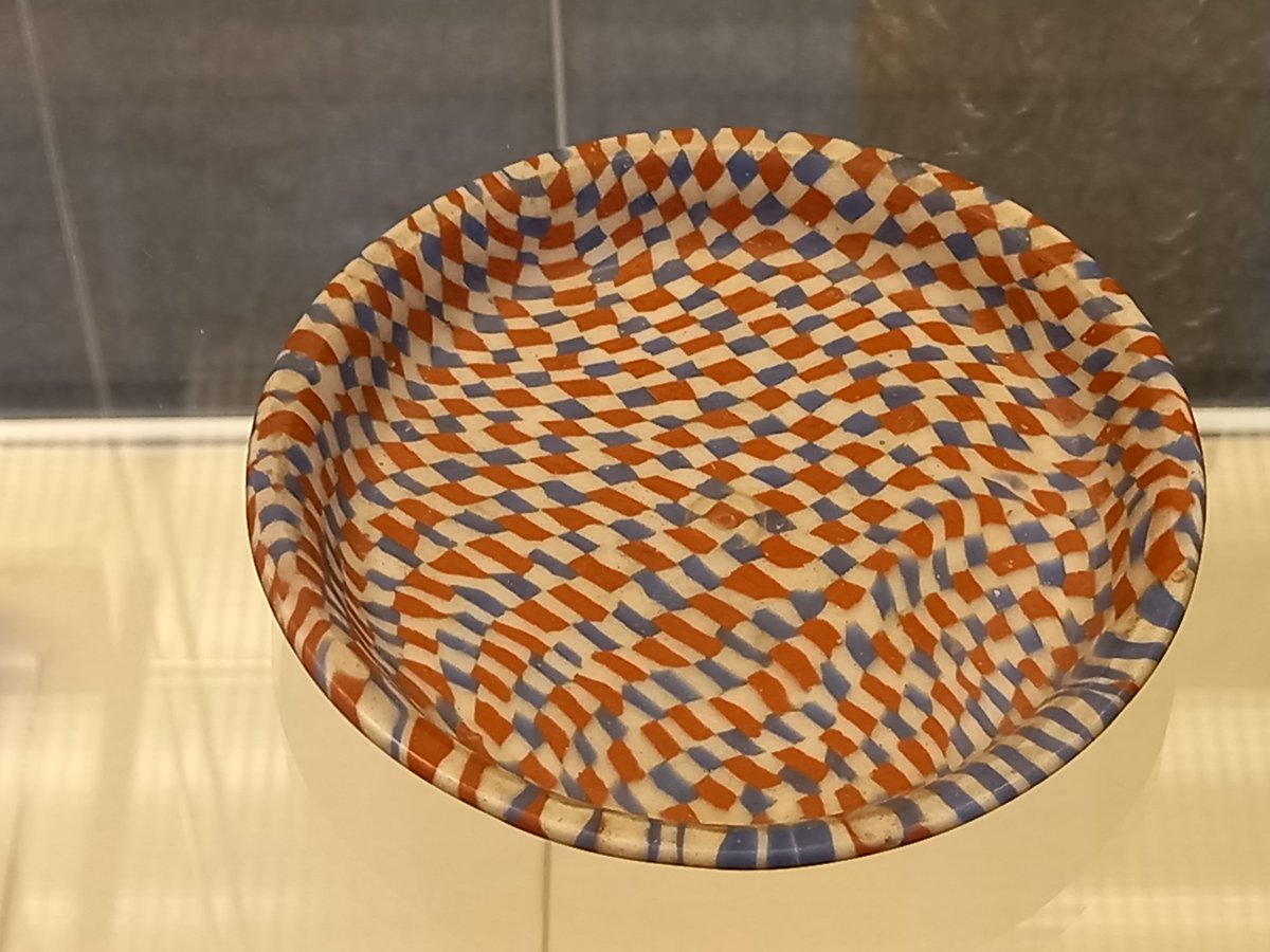 A #Roman glass dish, with a chequerboard design in red, blue, &amp; white. It was probably made in Egypt around 2000 years ago, but was likely found in northern Italy #Archaeology #AncientGlass