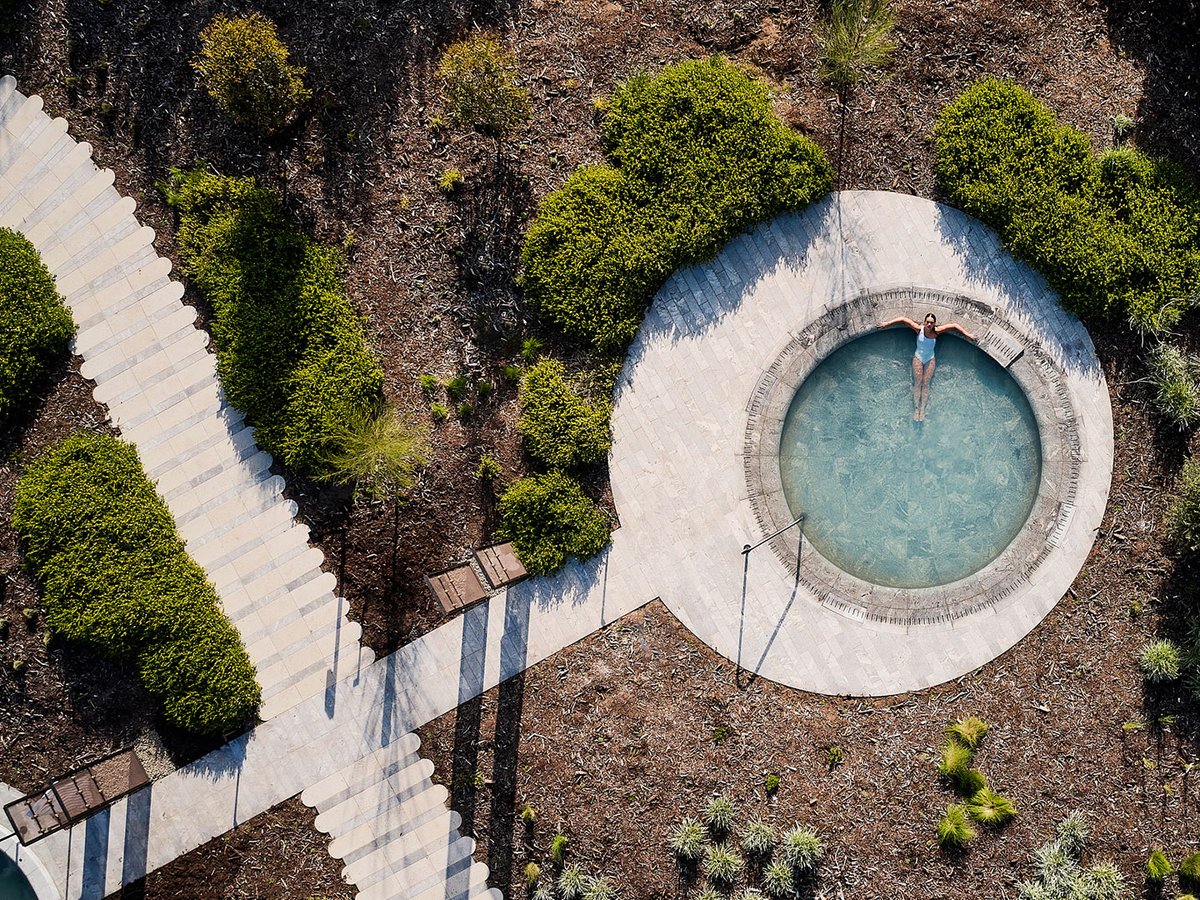 A pathway of rounded #concrete #steppers winds through the landscape, leading guests through the grounds of #AlbaThermalSprings to explore the #heatedpools on offer.

Paving, pool coping and custom walling units supplied by Anston in late 2022.

Images courtesy of Alba.