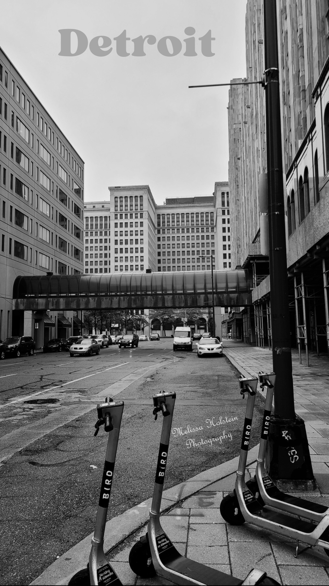 Stunning black and white street photograph of Cadillac Place in Detroit on a rainy day. A perfect blend of old and new, this photo captures the essence of Detroit's unique charm. 
#Detroit #streetphotography #blackandwhitephotography  #womeninphotography #PureMichigan