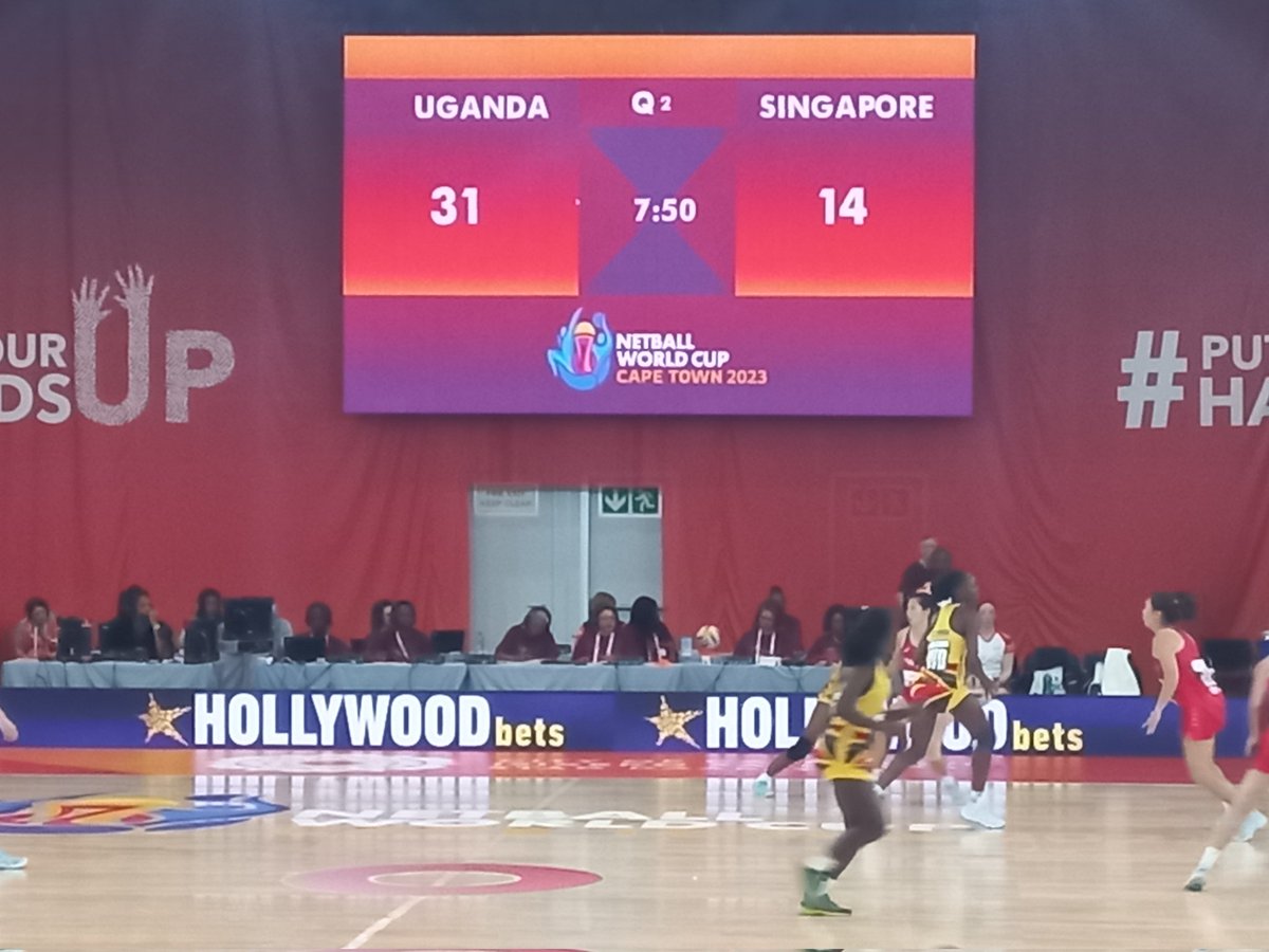 AmoruPaul's tweet photo. Exciting match at the Netball World Cup between Uganda and Singapore! Shecranes are dominating with a comfortable lead. Thrilled to be alongside Hon. Minister Kaducu Joyce, Hon. Kyinyamatama, Gen. Bwekwaso, and the vibrant Ugandan diaspora, celebrating the team's tremendous performance. Go Shecranes, keep making us proud! 🏐🇺🇬 #NetballWorldCup" @BigirwaNorah @UgandaMFA @OgwangOgwang @Educ_SportsUg @UgandaMediaCent