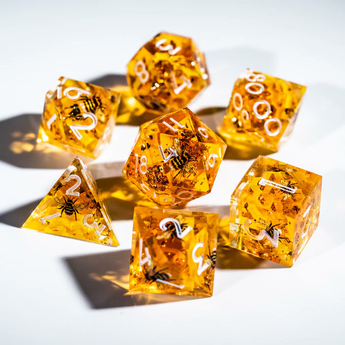 urwizards's tweet image. 🎁GIVEAWAY ALERT!🎊
Buzzzz!🐝 We've created this bee dice.🎲
These honey-hued cuties have etched bees ready to bring some sweetness to game!
The translucentgolden resin glitters like a 🍯. Follow and RT to enter to win a set of our honeybee dice with buzzing details! 
To enter:…