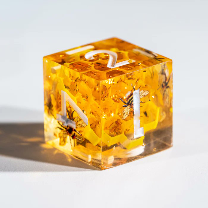 urwizards's tweet image. 🎁GIVEAWAY ALERT!🎊
Buzzzz!🐝 We've created this bee dice.🎲
These honey-hued cuties have etched bees ready to bring some sweetness to game!
The translucentgolden resin glitters like a 🍯. Follow and RT to enter to win a set of our honeybee dice with buzzing details! 
To enter:…