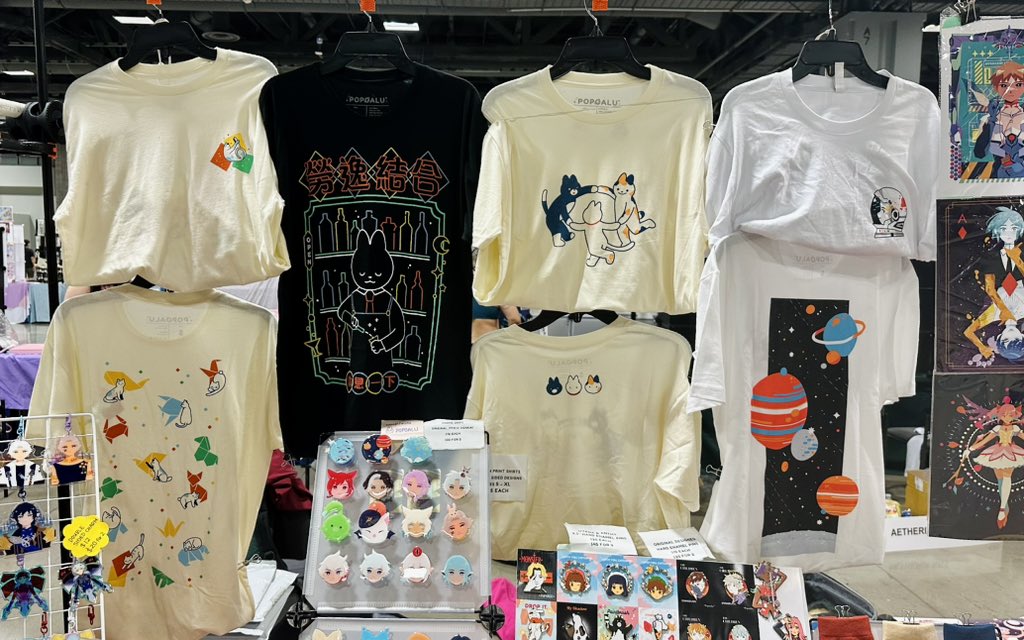 Im at Otakon with @zellsprout at table D306! ☀️ Lots of shirts, hats, pins, socks, etc! 🌟 Come say hi if you’re in the area! 🥹🫨👋