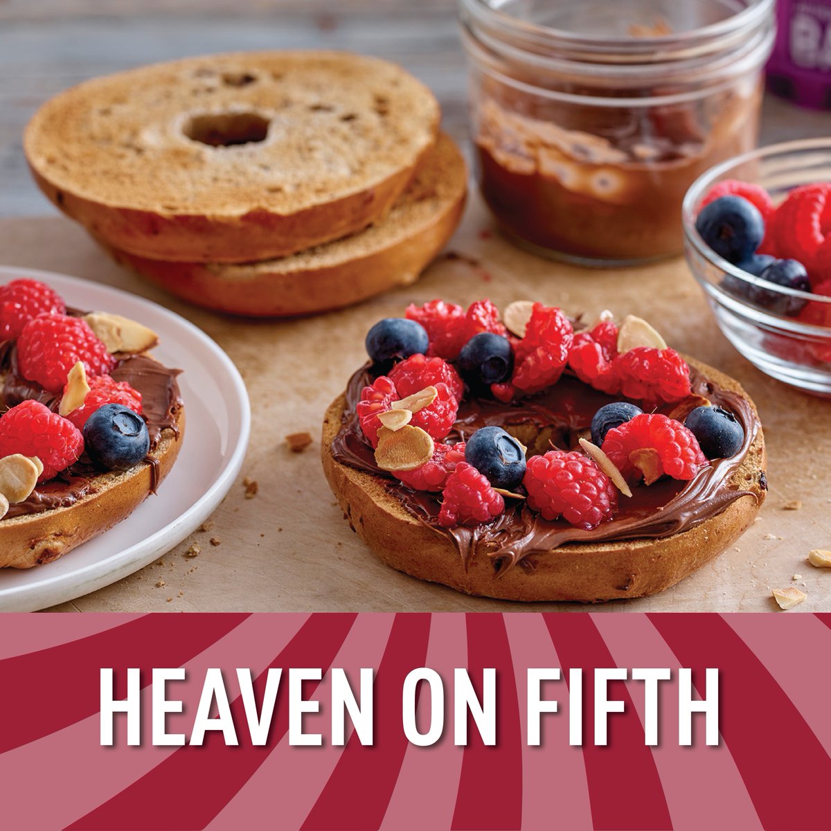 Here's what we think makes a good spread. A cinnamon raisin bagel topped with chocolate hazelnut spread, berries, and almonds. The sweetest #breakfast ever. 🍓🍫