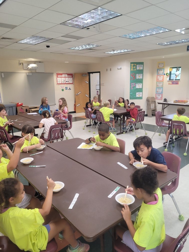 Extended Day Summer camp enjoying some Ramen while learning to use chop sticks!!!!