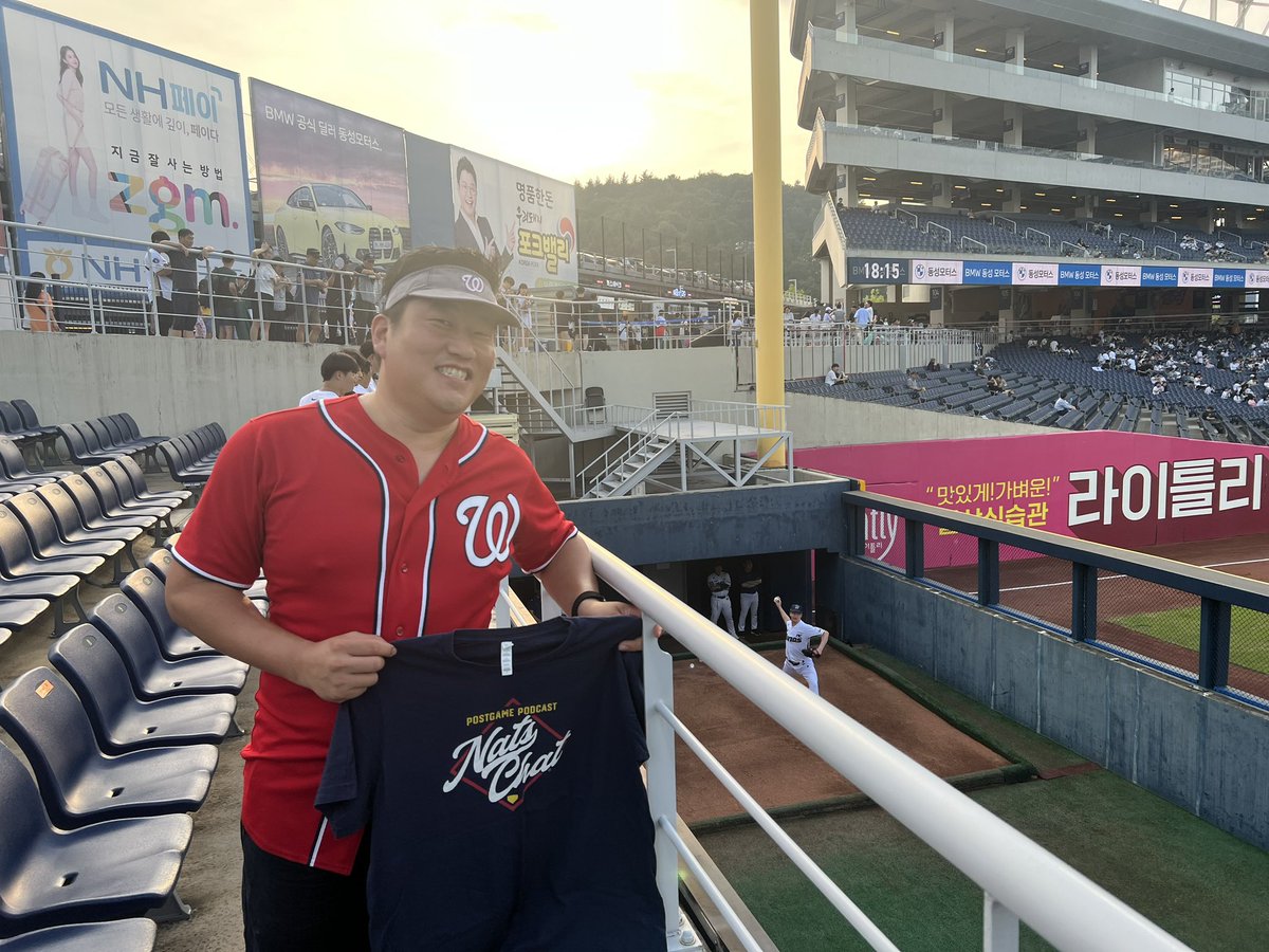 parkSMASH's tweet photo. @Nats_Chat @AlGaldi @MarkZuckerman Yesterday took a 3hr train ride to Changwon to finally see NC Dinos @ErickFedde dominate the KBO.  Wife got me awesome seats, didn’t realize I was on screen for most of the game.  I should have placed the Nats Chat t-shirt in better positioning. https://t.co/4vt5amXuQu