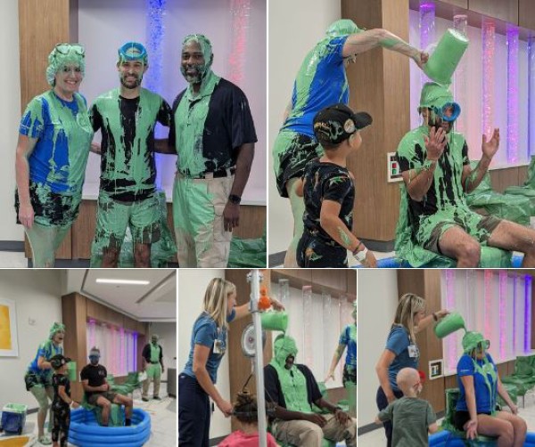 mlbreit's tweet photo. It was Slime Time at #ChildrensMercy Camp Week yesterday! Sporting Kansas City Defender, Graham Zusi, Security Office Supervisor, Edwin, and Patient and Family Services Program Manager, Trista, were all up for a messy sliming! Who should we slime next year?! https://t.co/iz9BgyLKgO