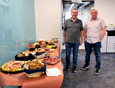AuxCapPartners's tweet photo. Revolutionizing equipment financing creates BIG appetites! Auxilior’s “Meat and Greet”, organized by Mike Noble (left) &amp; Dominick Cevet, had team members coming together to create a giant charcuterie board to enjoy a few snacks and each other’s company. https://t.co/xA6ntXp3hH
