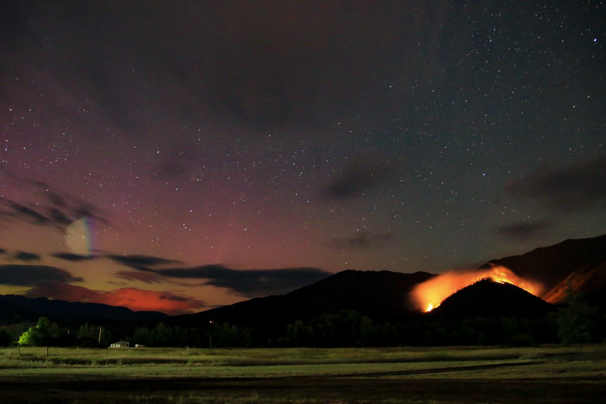 MitchelNBCMT's tweet photo. I want to share one of the most unique photos I've ever taken. It was taken near Arlee, #Montana on July 26. On the right, we have the #BigKnifeFire, the smoke plume in the distance is the #ColtFire and above that is the #northernlights! Share your photos: https://t.co/Q5NPaJ0P29 https://t.co/24TOtTywvD