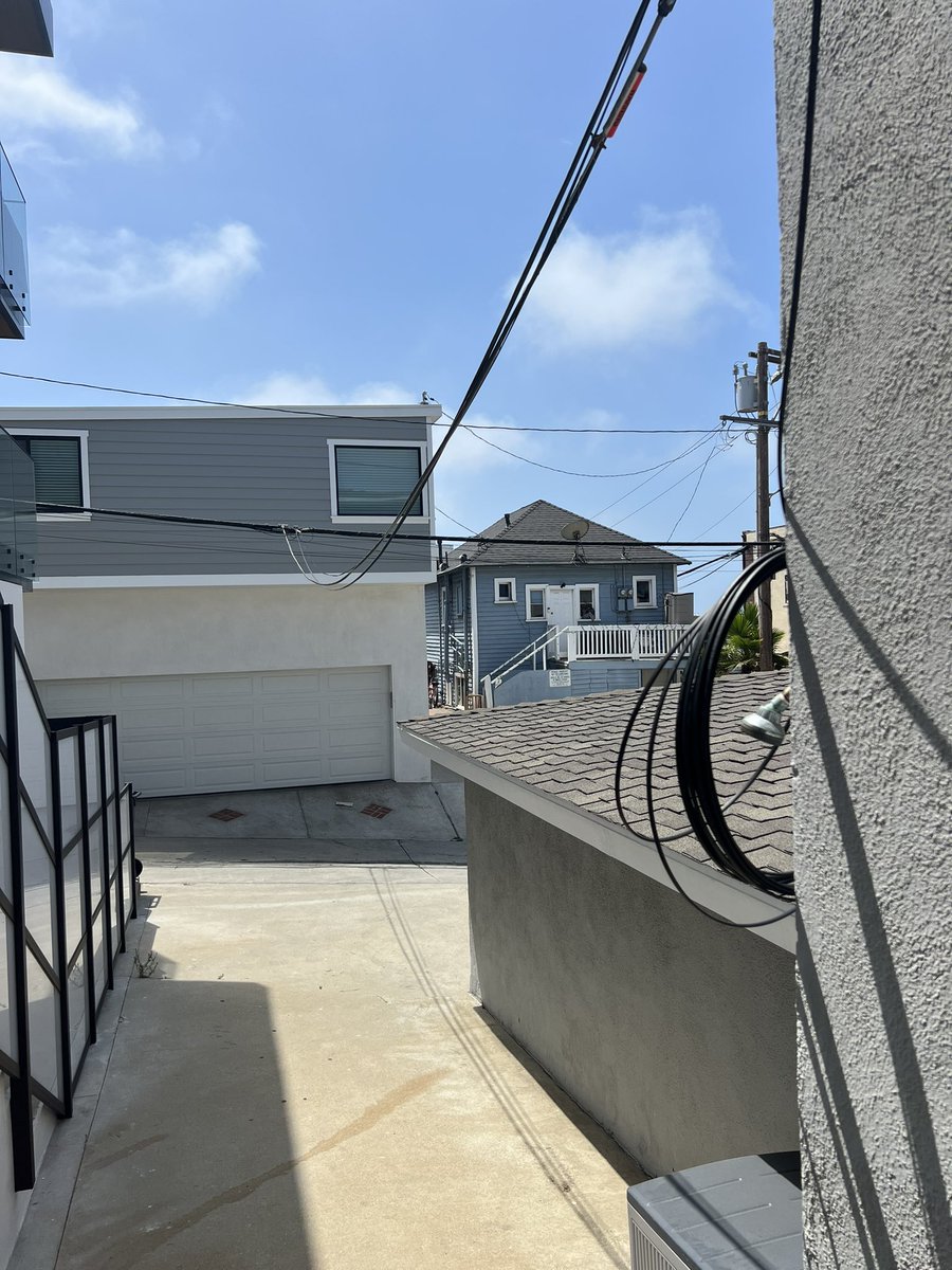 KrisTinsley's tweet photo. @SCE Noticed this re-wiring hack job done by your linemen on our property. Excess wiring wrapped around the outdoor shower…really?! Completely unsafe &amp; a job we did not request or authorize. I’ve called &amp; reported this, but cannot believe your employees lack of consideration. https://t.co/orAJRtA3ps