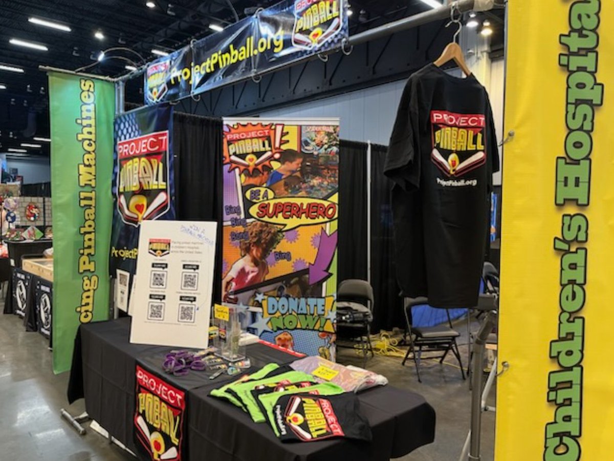ProjectPinball's tweet photo. The #ProjectPinballCharity Booth is ready for action at @SFGamingExpo! We can't wait for everyone to try out the #ADAAccessible Controller on our Jurassic Park machine! Thank you to Inclusive GameWerks for your efforts to make #pinball accessible for everyone! LET'S HAVE FUN!๐ https://t.co/R2v6mMuZTW
