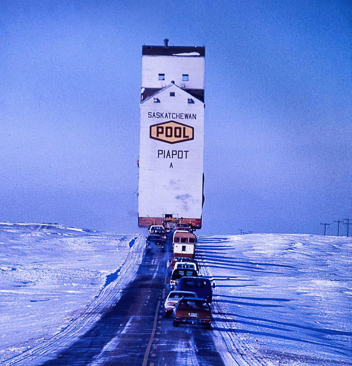 A Saskatchewan Grain Elevator being moved in 1979.  photo credit: Jerry Kambeitz/Macleans magazine.