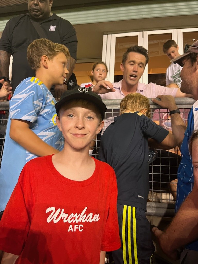 drewolsen's tweet photo. Drove 8 hours from Canada to Philly to see @Wrexham_AFC and my son got thissss close to meeting @RMcElhenney. One away when security closed lineup #maybenexttime https://t.co/V8833SUa4p