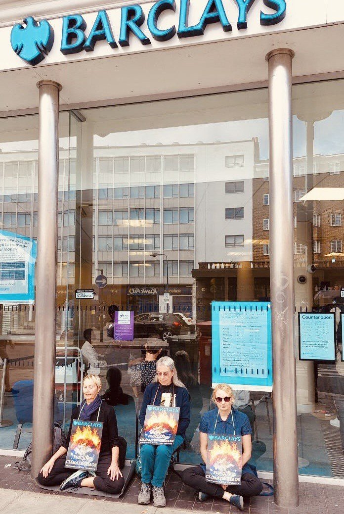 XRLambeth's tweet photo. Yesterday Lambeth rebels took part in a meditation at Barclays in Streatham as part of a UK-wide action.

@Barclays invested +$190bn in coal, oil &amp; gas in the last 6yrs.  

Great to hear several people saying they're switching bank 💚
Want to do the same? https://t.co/Yf9ixv3yq0 https://t.co/GhSdQE8VpX