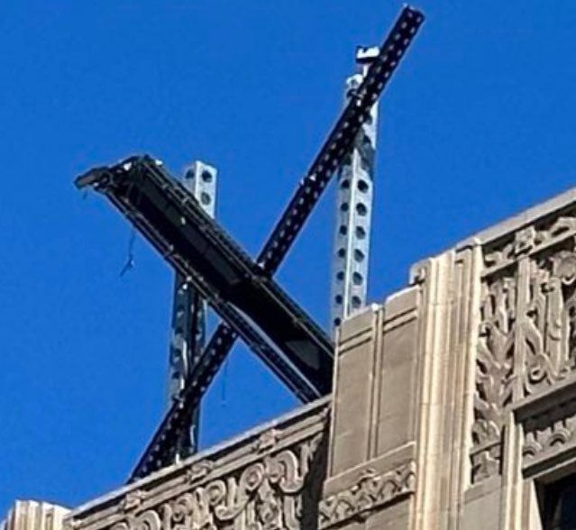DJohnBrown's tweet photo. “Due to a recent addition to the building exterior, the client has suggested a rather novel &amp; ironic method of completing this contract. Good luck 47.” https://t.co/fVptX2Tabh