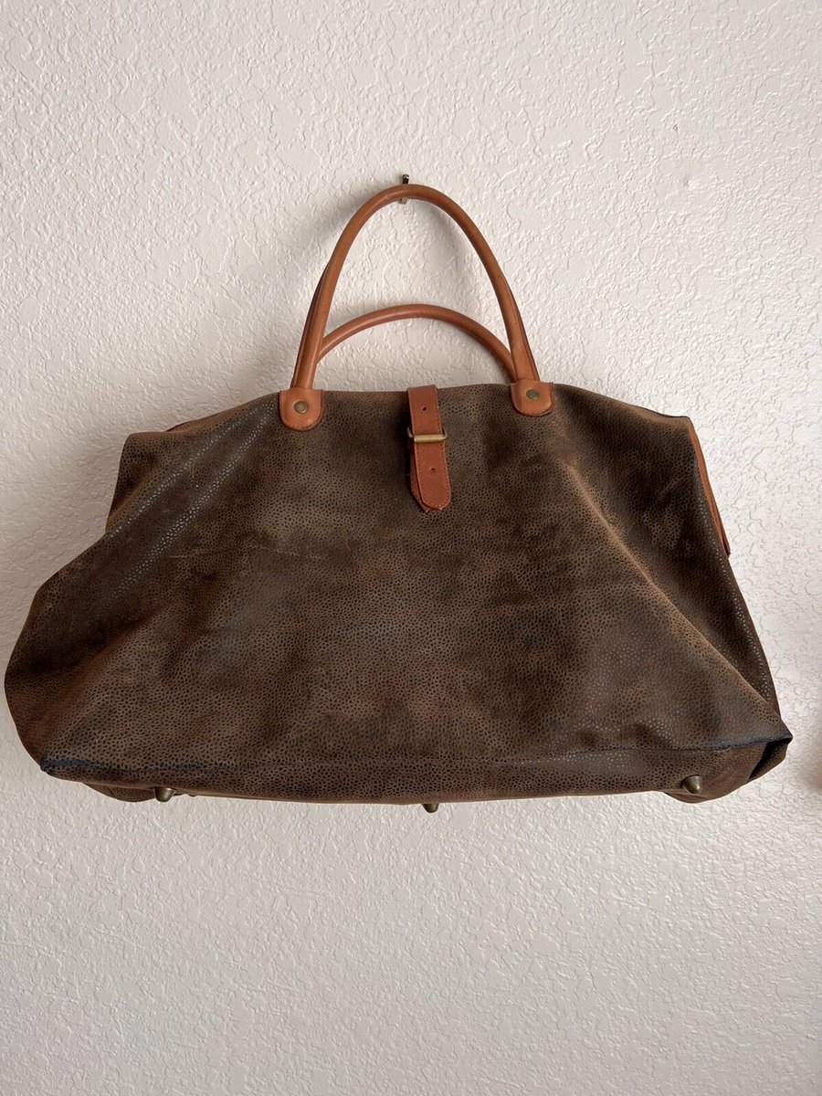 Ok! Sorry! I have to say it! This bag is supercaliflagalisticexpialadoshus!!! Check out this MARY POPPINS BAG IN SUEDE AND LEATHER LUGGAGE WEEKEND BAG MADE IN ITALY. Hold all of your travel items in perfect style. BETTER THAN A SPOONFUL OF SUGAR!