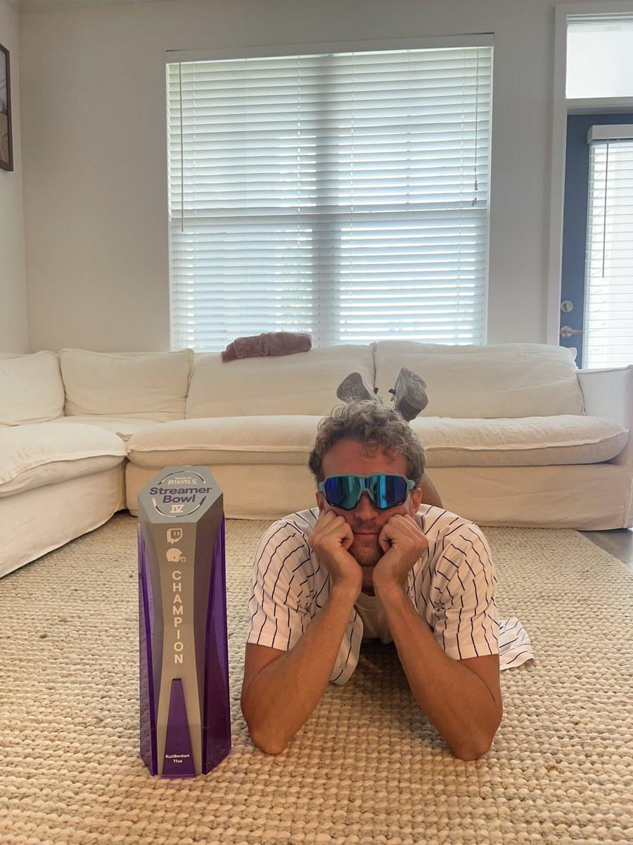 KurtBenkert's tweet photo. My brother in law is staying in our FL place right now while we are gone. I had my @NFLPA Twitch Rivals trophy come in and asked him for pictures of it.. he sent these๐๐ผ๐ https://t.co/xNHZAWKybW
