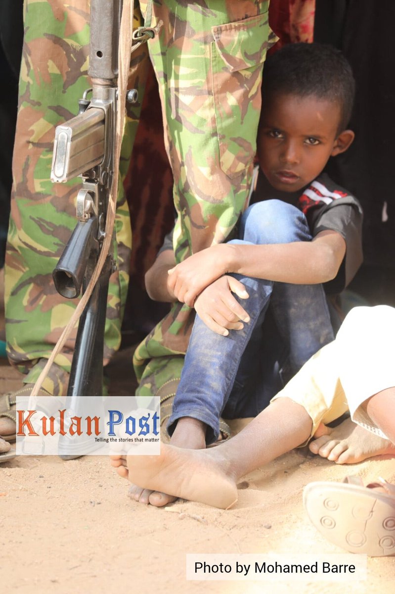 kulanpost's tweet image. PICTURE: This boy clutched onto a policeman's leg in a bid to protect himself from the sunlight during a welcoming event for the area MP at Korondile town, Wajir North. 

[Photo: Mohamed Barre]