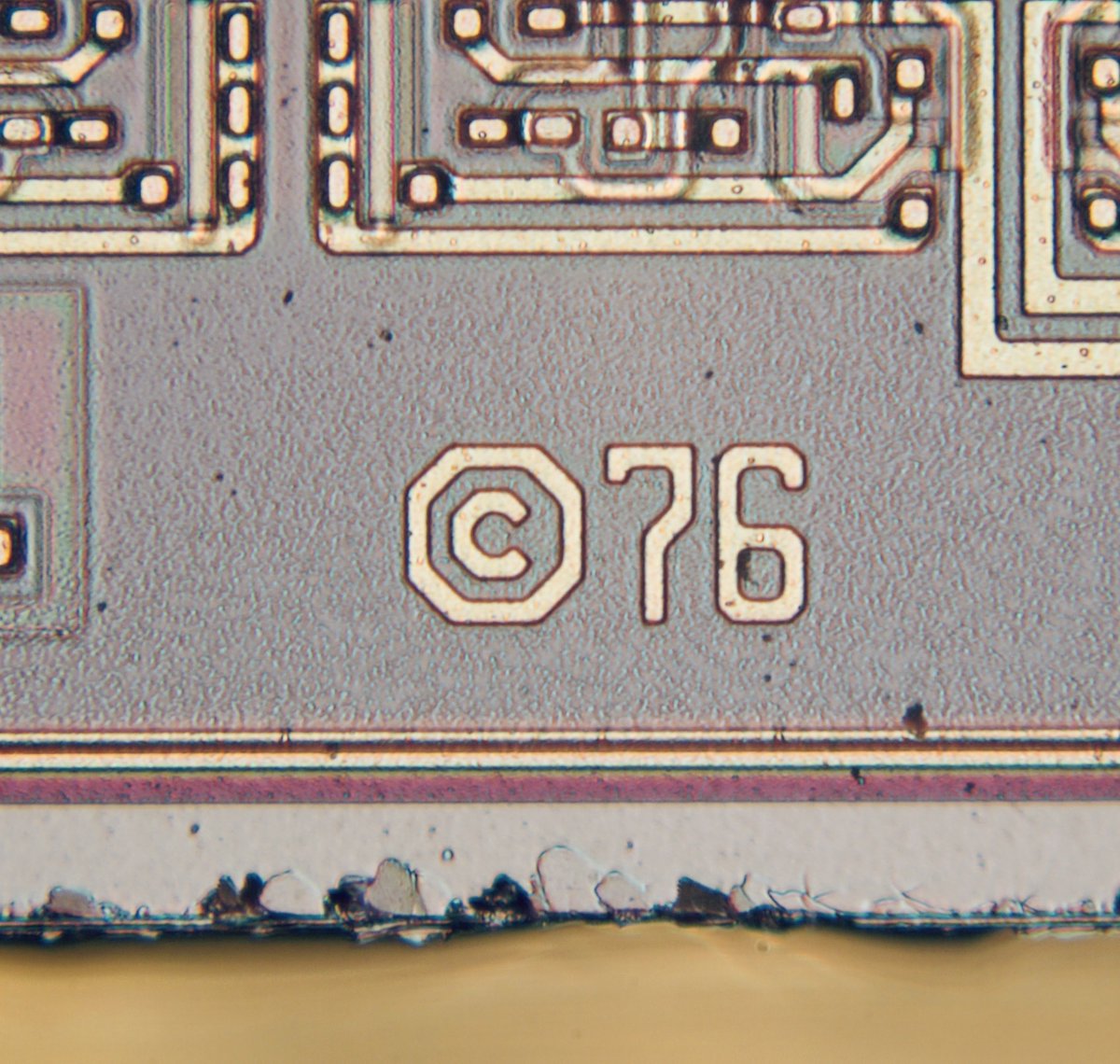 duke_cpu's tweet photo. It’s a #Lotus flower! This tiny Asian floral ornament is to be found on the #vintage IC made by #Intersil. The CerDIP package of the IM7008 was produced in Singapore in early 1978 and the chip was originally designed in (c) 1976. It took the #silicondoodle flower 45 years to see the sun light again!