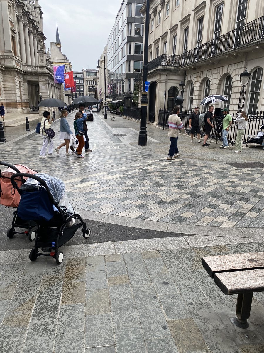DavanportTony's tweet photo. Who are these people under the black umbrella’s ?? Seen outside filming in @London @splitzfacilities just by Bond Street https://t.co/UqUdIxplCq
