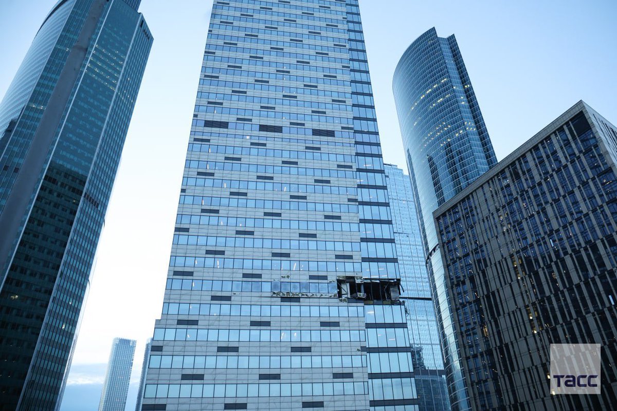 sentdefender's tweet image. I’m seriously amazed that the Damage to the “IQ-Quarter” Building from the Ukrainian Drone Attack was only Limited to that 1-Floor with even the Windows around where the Drone struck appearing to be almost Totally Intact; the Complex was only Completed in 2016 so it possible the…