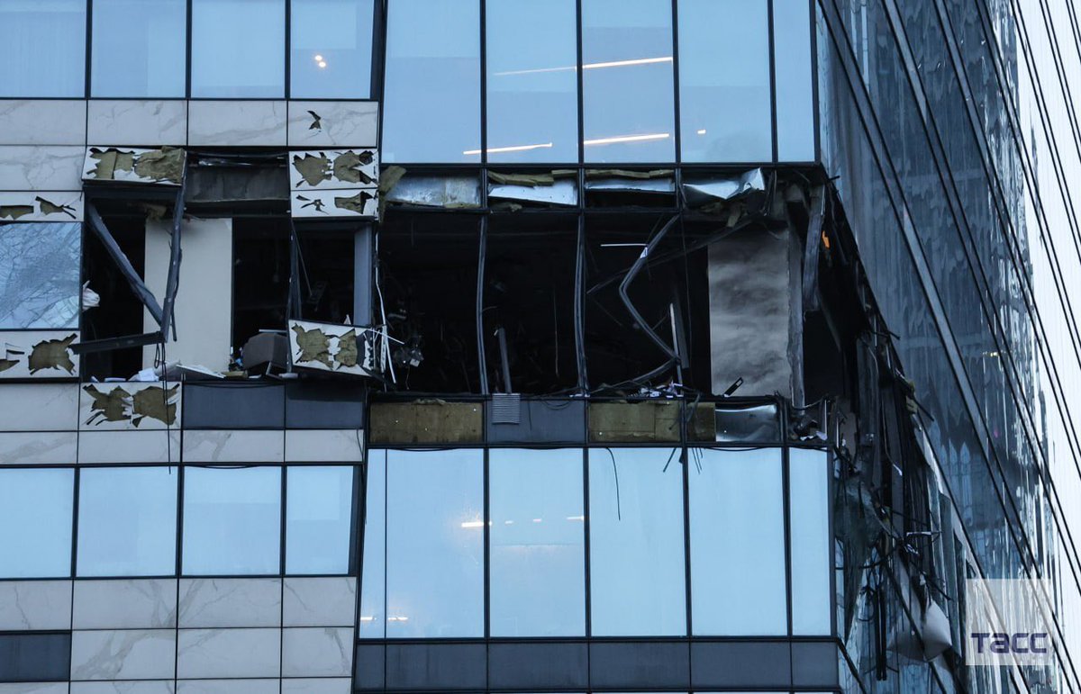 sentdefender's tweet image. I’m seriously amazed that the Damage to the “IQ-Quarter” Building from the Ukrainian Drone Attack was only Limited to that 1-Floor with even the Windows around where the Drone struck appearing to be almost Totally Intact; the Complex was only Completed in 2016 so it possible the…